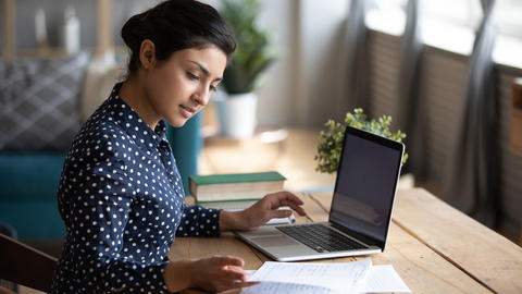 Person typing at laptop