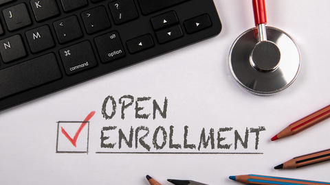 Open Enrollment with a keyboard and pens